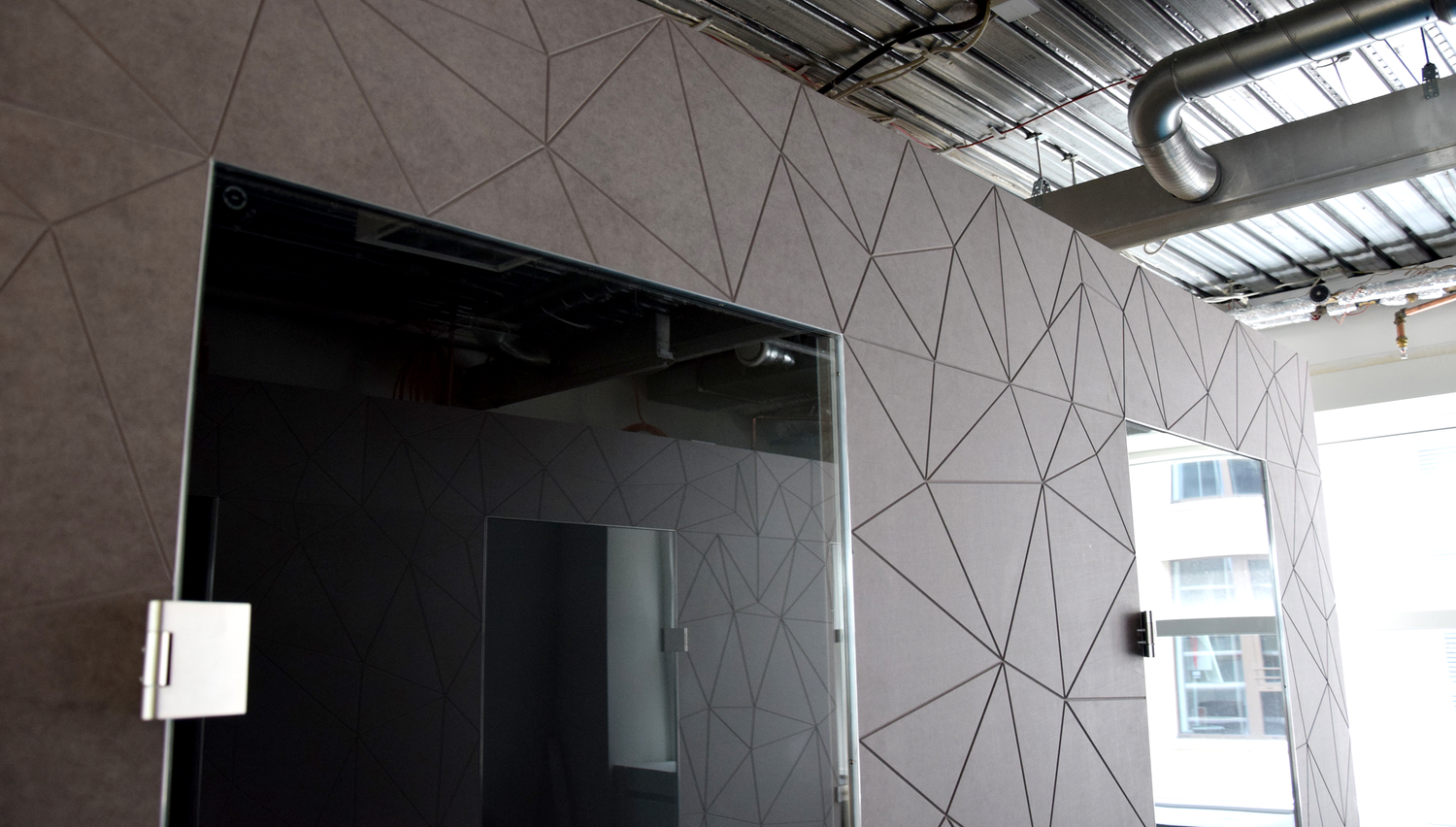 TechQuartier hub interior — installed faceted furniture and wall systems