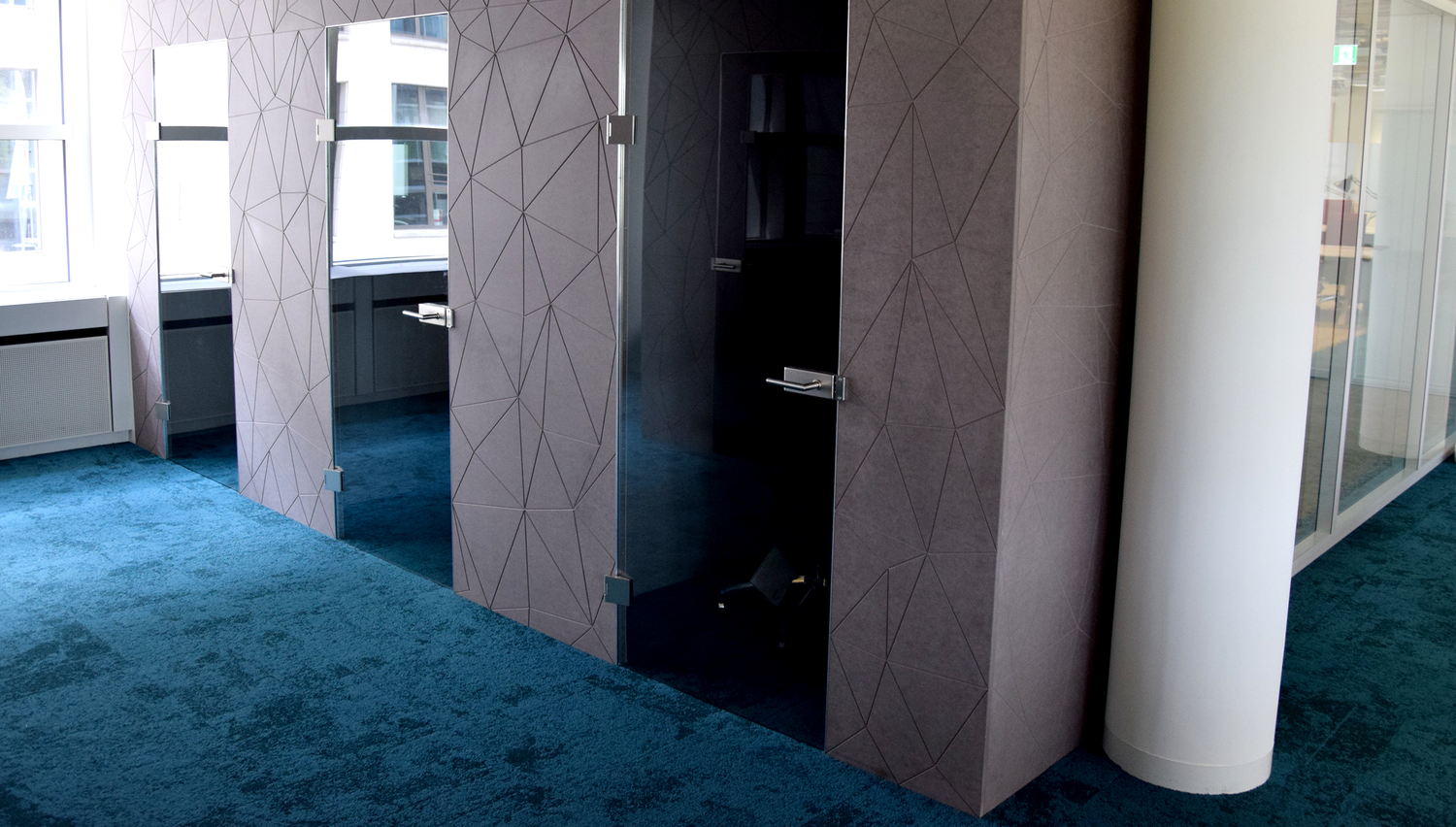 TechQuartier hub — installed interior, faceted wall system